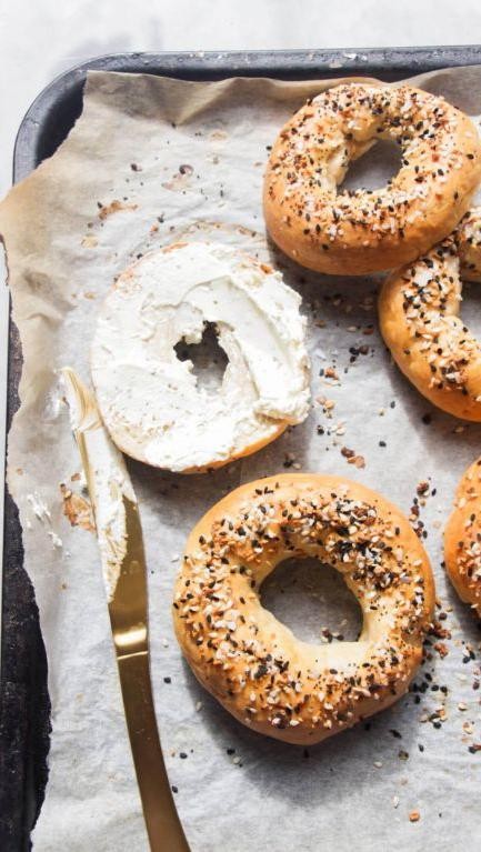 Bagel with butter and a side of yogurt
