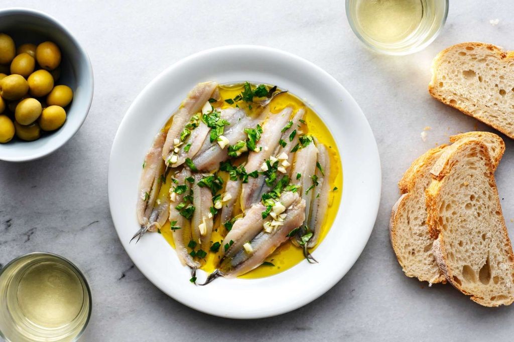 Boquerones en vinagre (marinated white anchovies)