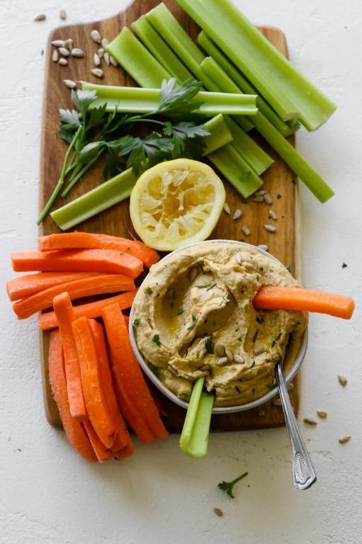 Celery Sticks with Hummus and Sunflower Seeds