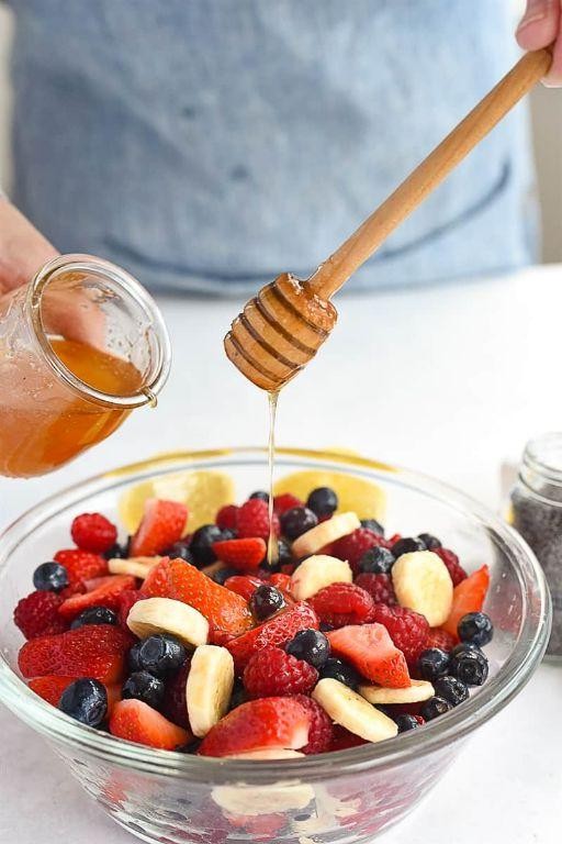 Fruit salad with a drizzle of honey