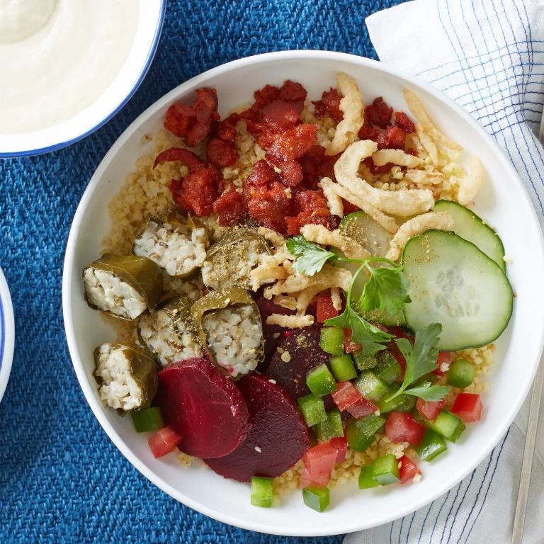 Stuffed grape leaves and hummus bowl