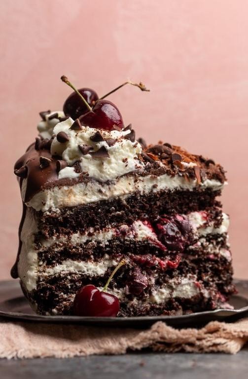 Black Forest Birthday Cake with Cherries and Whipped Cream