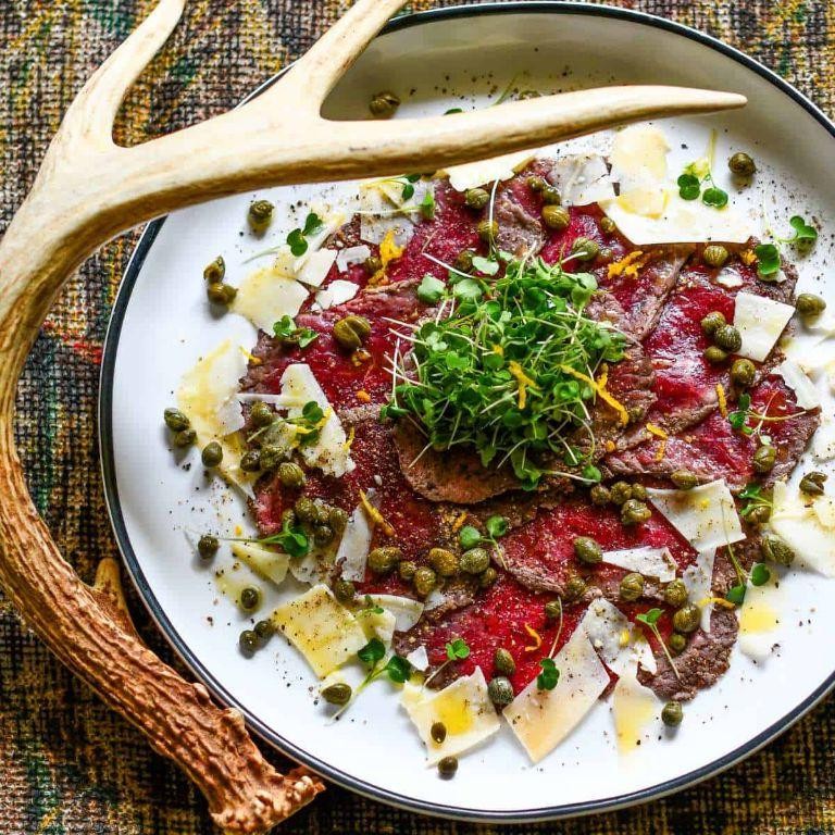 Elk Tenderloin Carpaccio with Truffle Oil and Arugula
