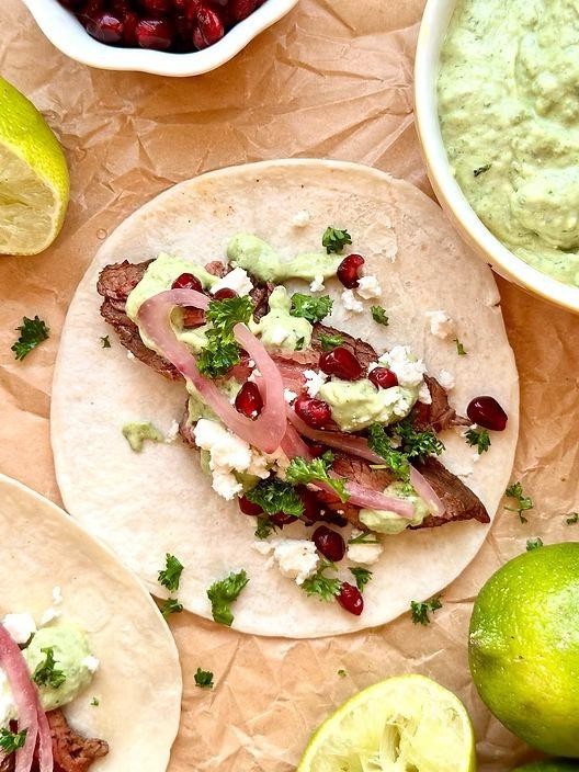 Pepper Steak and Onions Tacos with Lime Crema