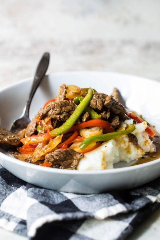 Pepper Steak and Onions over Garlic Mashed Potatoes