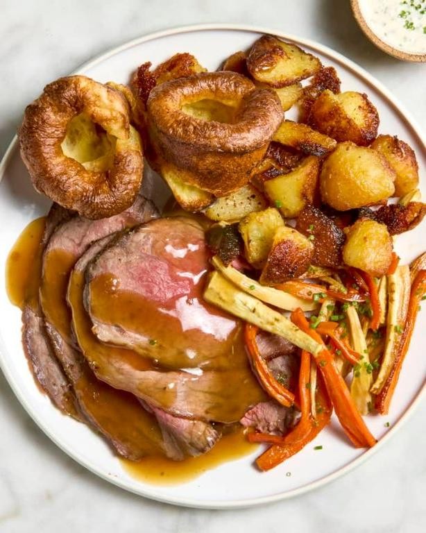 Traditional English Sunday Roast with Beef and Yorkshire Pudding