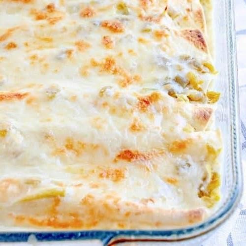 White Chicken Enchilada Casserole with Sour Cream Sauce